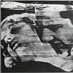 Rear cover of Enola Gay's single showing detail from Warhol's "Bela Lugosi" print.